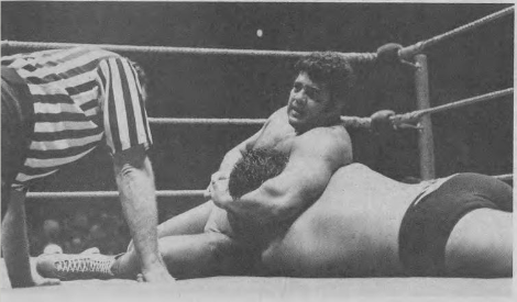 Pedro Morales applies a headlock to the Magnificent Muraco during a professional wrestling match, circa 1982